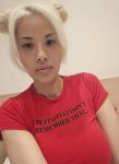 Chinese ProDomme wearing sheer pantyhose at Fetish Fortress